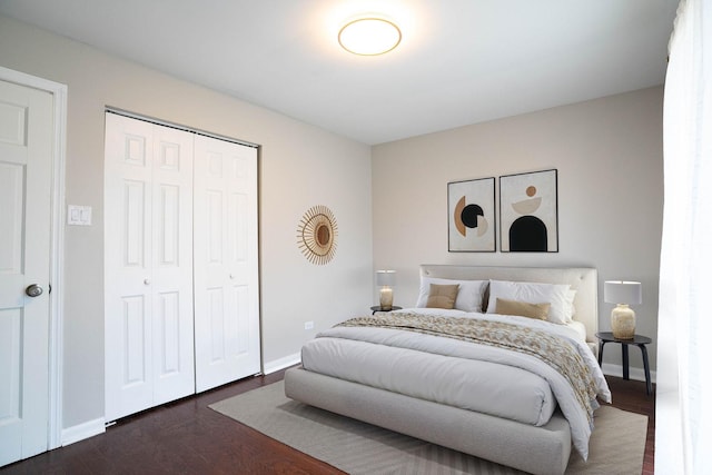14117 S Calhoun Ave, Burnham, IL 60633 - bedroom featuring dark wood-style floors, a closet, and baseboards