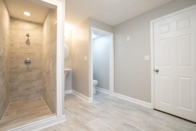 14117 S Calhoun Ave, Burnham, IL 60633 - full bathroom featuring tiled shower, toilet, and baseboards