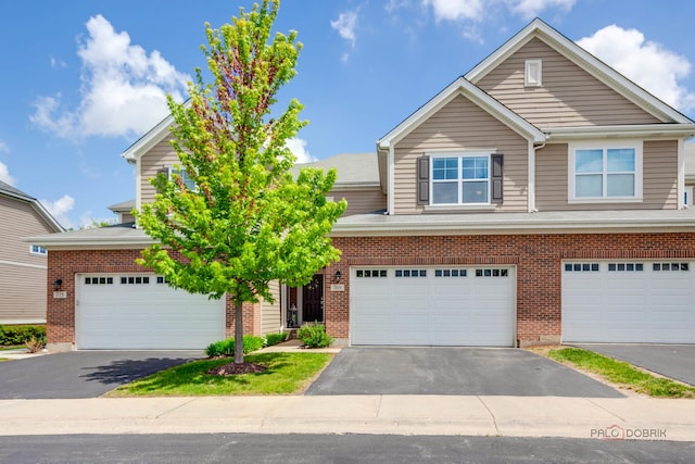 769 N Winchester Dr, Palatine, IL 60067 - view of front of home with brick siding and driveway