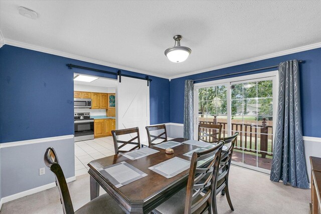 1803 Galena St, Urbana, IL 61802 - dining room featuring a barn door, crown molding, a textured ceiling, and light carpet