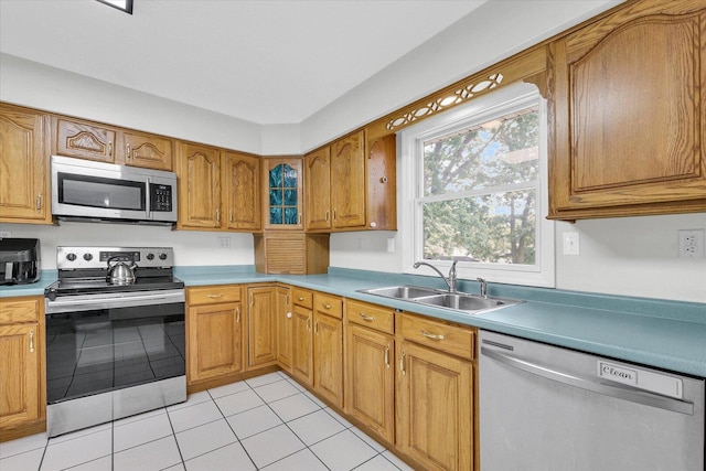 1803 Galena St, Urbana, IL 61802 - kitchen with appliances with stainless steel finishes, light tile patterned flooring, and brown cabinets