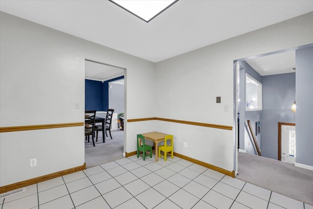 1803 Galena St, Urbana, IL 61802 - tiled empty room featuring carpet and baseboards