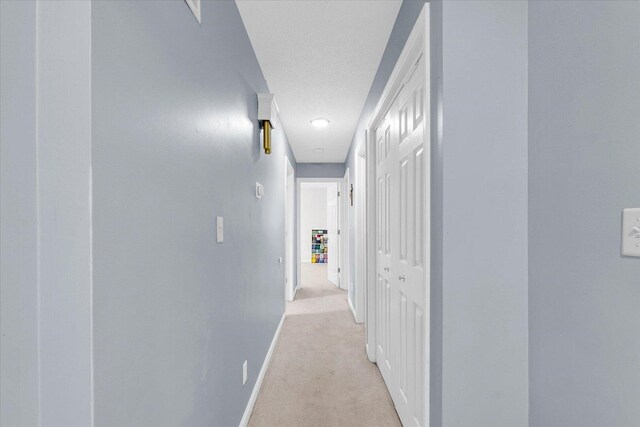 1803 Galena St, Urbana, IL 61802 - hall with light colored carpet and a textured ceiling