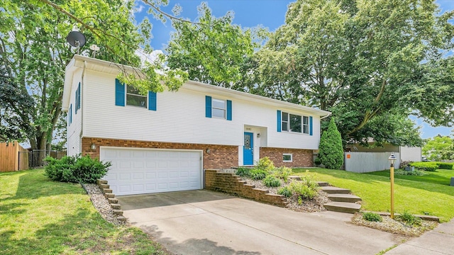1803 Galena St, Urbana, IL 61802 - split foyer home with brick siding, an attached garage, and driveway