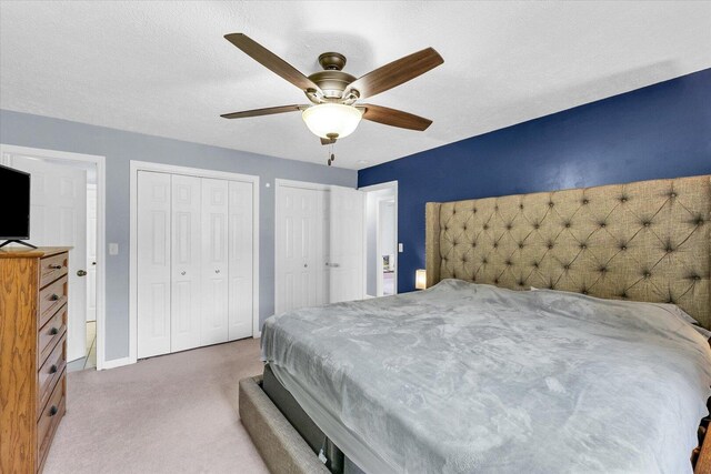1803 Galena St, Urbana, IL 61802 - bedroom featuring two closets, carpet, and ceiling fan