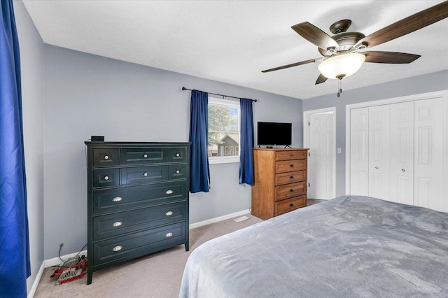 1803 Galena St, Urbana, IL 61802 - bedroom with light colored carpet, a closet, and a ceiling fan