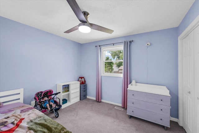 1803 Galena St, Urbana, IL 61802 - bedroom with carpet floors, a ceiling fan, and a textured ceiling