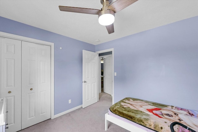 1803 Galena St, Urbana, IL 61802 - bedroom with light colored carpet, a closet, and a ceiling fan