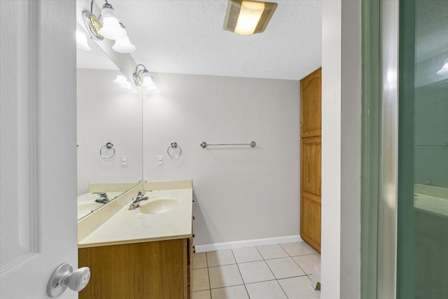 1803 Galena St, Urbana, IL 61802 - bathroom with vanity, tile patterned flooring, and a textured ceiling