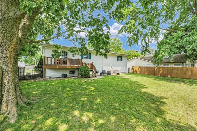1803 Galena St, Urbana, IL 61802 - rear view of house with a fenced backyard and a wooden deck