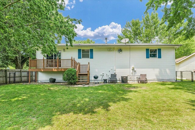 1803 Galena St, Urbana, IL 61802 - back of property with a deck, a fenced backyard, and stairway