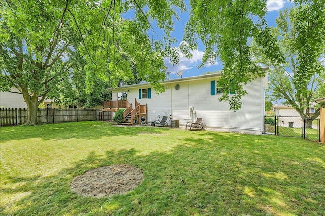 1803 Galena St, Urbana, IL 61802 - back of property with a fenced backyard, stairs, and a deck