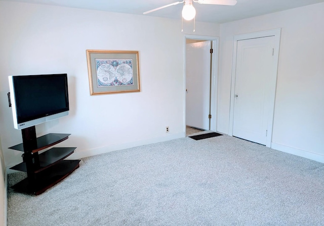 100 Watson Ave, Oglesby, IL 61348 - unfurnished living room featuring carpet floors, ceiling fan, and baseboards