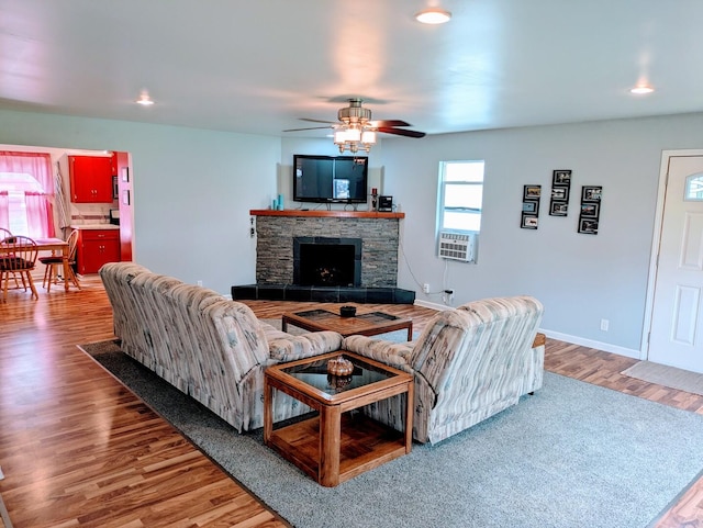 100 Watson Ave, Oglesby, IL 61348 - living area with light wood-style flooring, a fireplace, ceiling fan, cooling unit, and recessed lighting