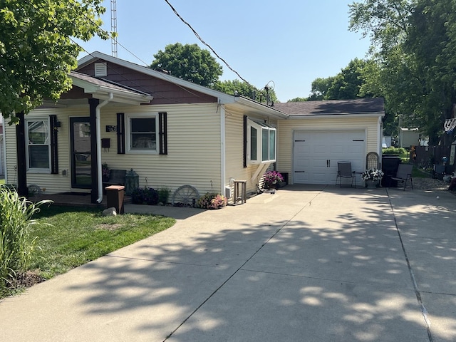 806 N Elizabeth St, Clinton, IL 61727 - view of front of house featuring a garage and concrete driveway
