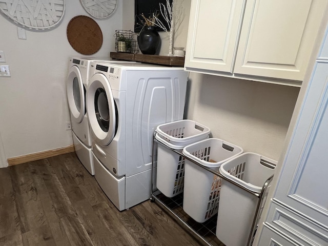 806 N Elizabeth St, Clinton, IL 61727 - laundry area featuring cabinet space, independent washer and dryer, dark wood-style flooring, and baseboards
