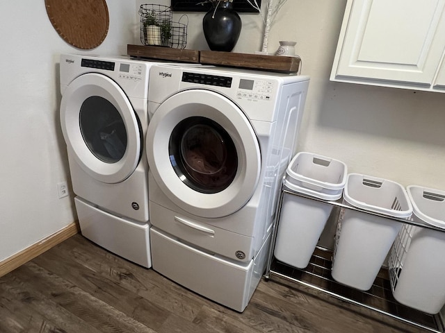 806 N Elizabeth St, Clinton, IL 61727 - laundry room with washing machine and clothes dryer, cabinet space, dark wood-style flooring, and baseboards