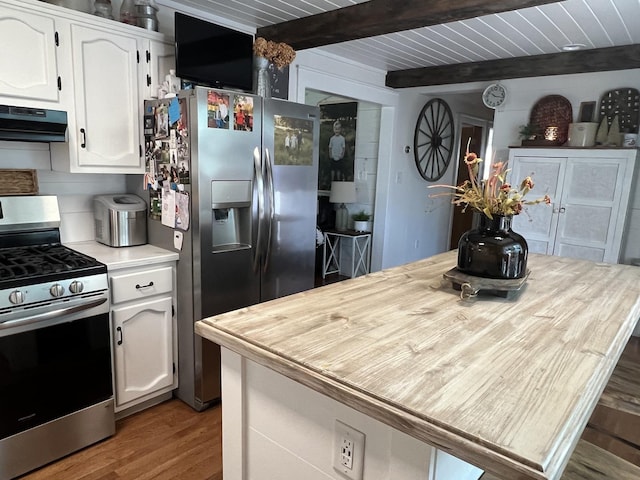 806 N Elizabeth St, Clinton, IL 61727 - kitchen featuring appliances with stainless steel finishes, range hood, beam ceiling, white cabinets, and light countertops