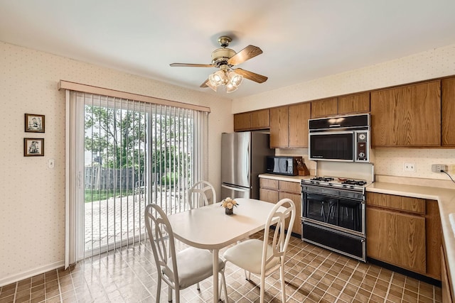1232 Sumac Trl, Hoffman Estates, IL 60192 - kitchen with black appliances, wallpapered walls, brown cabinets, ceiling fan, and light countertops