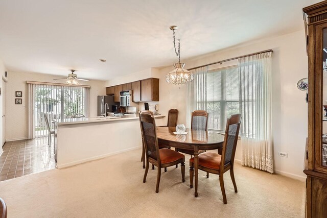 1232 Sumac Trl, Hoffman Estates, IL 60192 - dining space with a chandelier, baseboards, light carpet, and ceiling fan