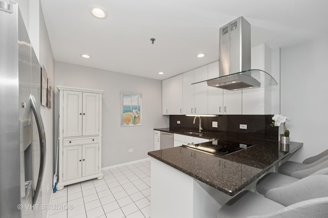 362 Kelburn Rd Unit 124, Deerfield, IL 60015 - kitchen with island range hood, appliances with stainless steel finishes, a sink, light tile patterned floors, and a peninsula
