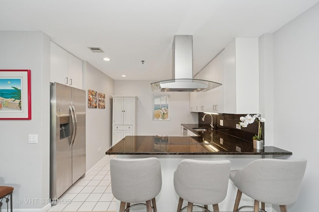 362 Kelburn Rd Unit 124, Deerfield, IL 60015 - kitchen featuring stainless steel fridge, range hood, a peninsula, a sink, and white cabinetry