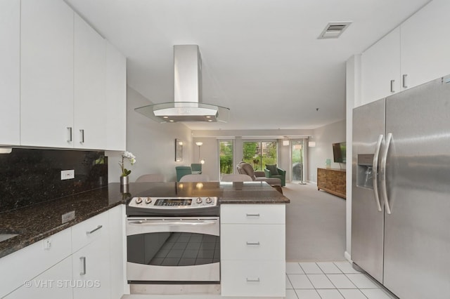 362 Kelburn Rd Unit 124, Deerfield, IL 60015 - kitchen featuring stainless steel appliances, island range hood, open floor plan, a peninsula, and white cabinets