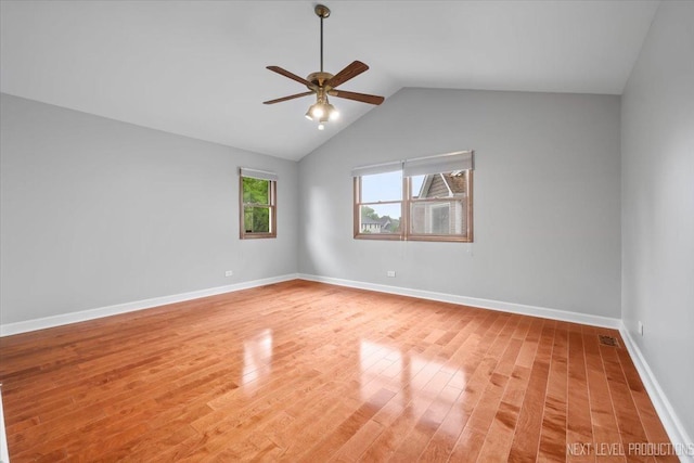 2556 Leach Dr, Naperville, IL 60564 - empty room featuring a ceiling fan, light wood finished floors, vaulted ceiling, and baseboards