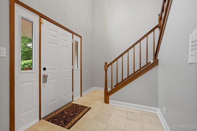 2556 Leach Dr, Naperville, IL 60564 - entrance foyer featuring stairway and baseboards