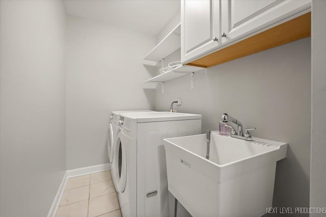 2556 Leach Dr, Naperville, IL 60564 - laundry area with separate washer and dryer, light marble finish floors, cabinet space, and baseboards