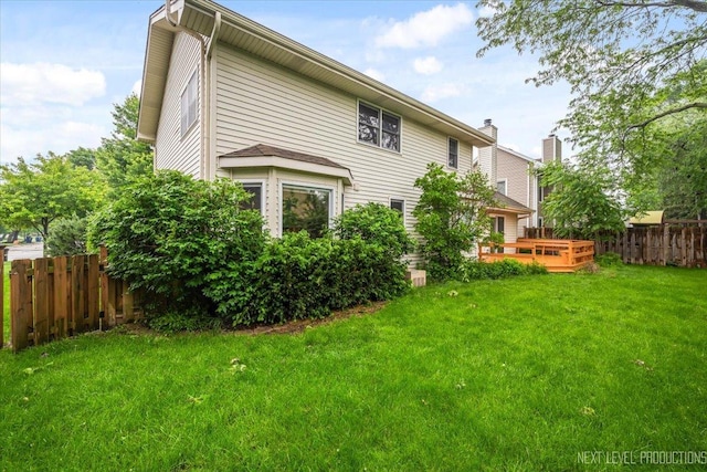 2556 Leach Dr, Naperville, IL 60564 - rear view of house featuring a wooden deck and a chimney