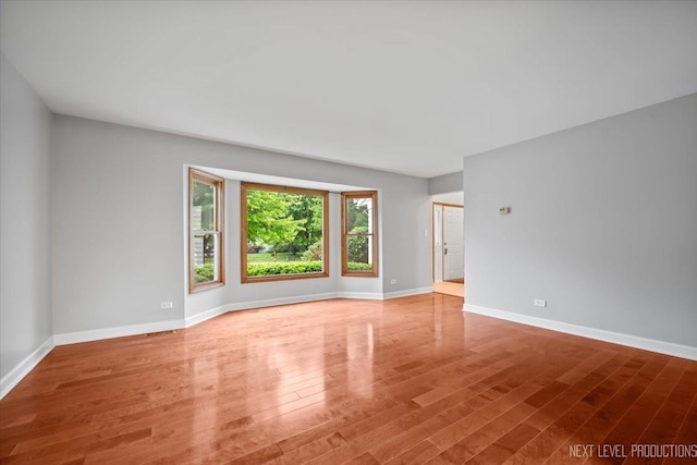 2556 Leach Dr, Naperville, IL 60564 - unfurnished room featuring wood finished floors and baseboards