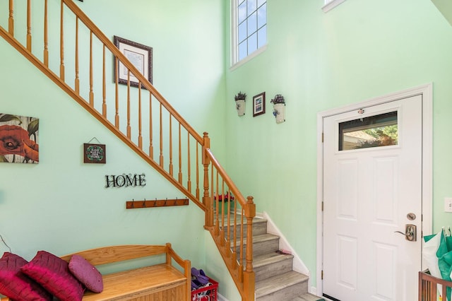 2715 Lahinch Dr, Aurora, IL 60503 - entryway with plenty of natural light, a towering ceiling, stairway, and wood finished floors