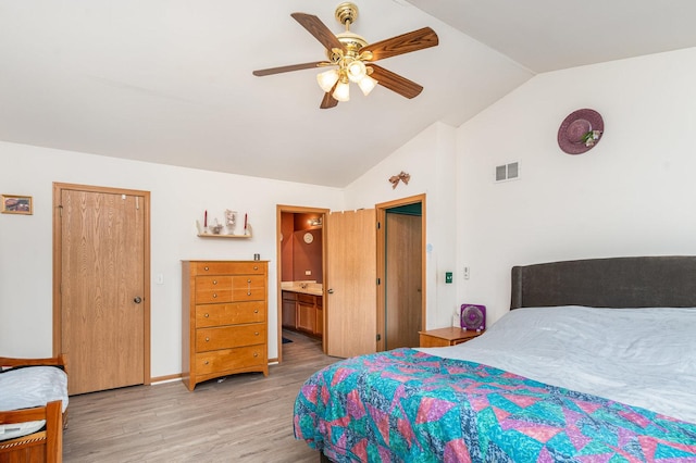 2715 Lahinch Dr, Aurora, IL 60503 - bedroom featuring light wood finished floors, vaulted ceiling, ceiling fan, and connected bathroom