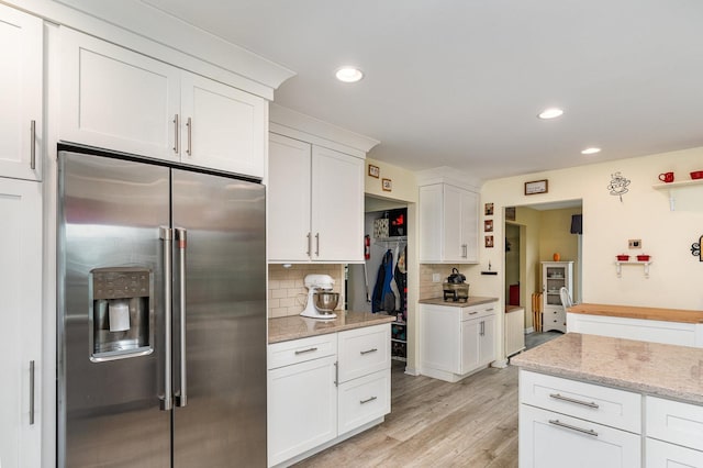 2715 Lahinch Dr, Aurora, IL 60503 - kitchen featuring stainless steel fridge, decorative backsplash, white cabinetry, light wood finished floors, and recessed lighting