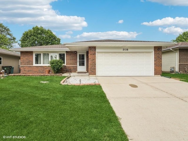 2136 N Westmoreland Dr, Palatine, IL 60074 - ranch-style home with brick siding, a garage, concrete driveway, and a front yard