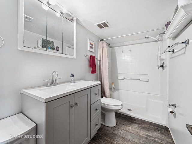 2136 N Westmoreland Dr, Palatine, IL 60074 - bathroom featuring a shower with shower curtain, vanity, and wood finished floors