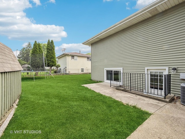 2136 N Westmoreland Dr, Palatine, IL 60074 - view of yard featuring a trampoline and a patio