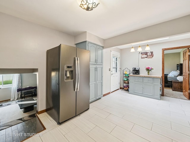 2136 N Westmoreland Dr, Palatine, IL 60074 - kitchen featuring stainless steel fridge, gray cabinets, plenty of natural light, and light countertops