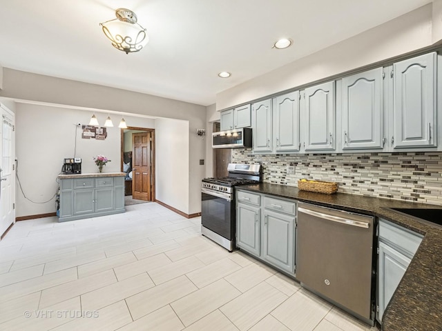 2136 N Westmoreland Dr, Palatine, IL 60074 - kitchen with stainless steel appliances, tasteful backsplash, gray cabinets, recessed lighting, and pendant lighting