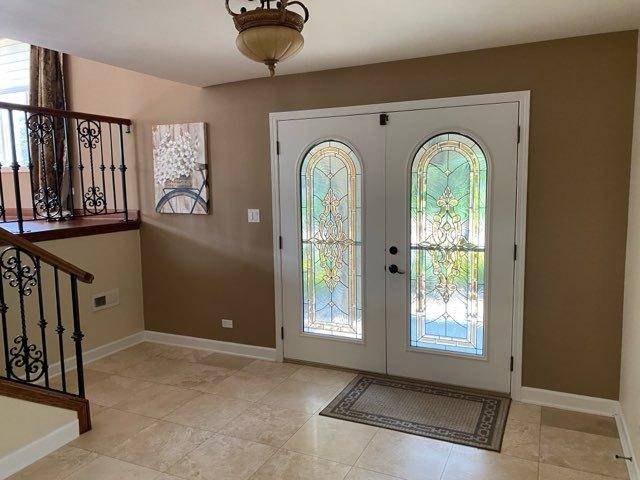 473 S Edgewood Ave, Wood Dale, IL 60191 - entryway with healthy amount of natural light, baseboards, and french doors