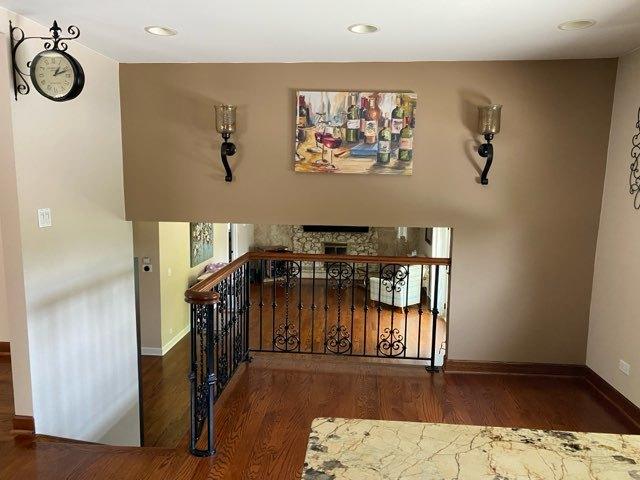 473 S Edgewood Ave, Wood Dale, IL 60191 - stairs with wood finished floors, baseboards, a fireplace, and recessed lighting