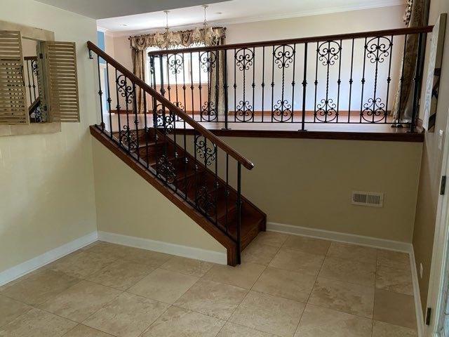 473 S Edgewood Ave, Wood Dale, IL 60191 - stairway featuring a chandelier, ornamental molding, and baseboards