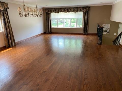 473 S Edgewood Ave, Wood Dale, IL 60191 - empty room featuring crown molding, a chandelier, wood finished floors, and baseboards