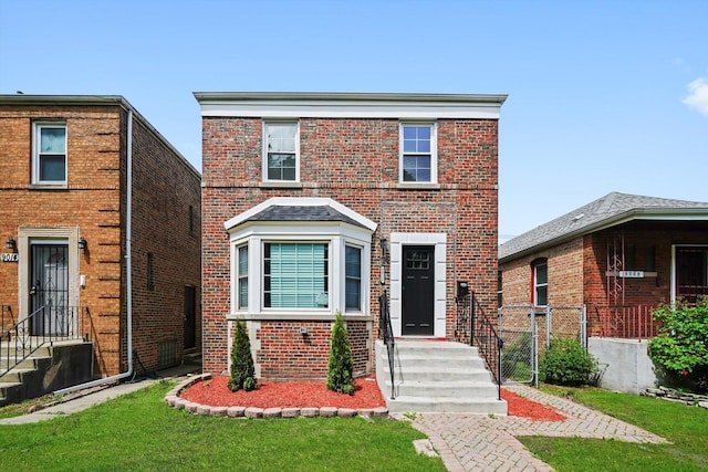 9012 S Harper Ave, Chicago, IL 60619 - view of front of house with brick siding and a front yard