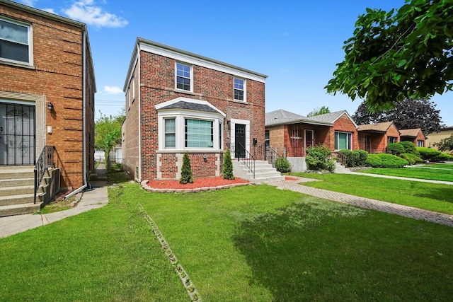 9012 S Harper Ave, Chicago, IL 60619 - view of front of house with a front lawn and brick siding