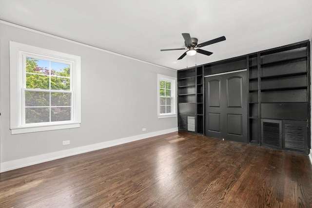 9012 S Harper Ave, Chicago, IL 60619 - unfurnished living room with baseboards, ceiling fan, wood finished floors, ornamental molding, and built in shelves