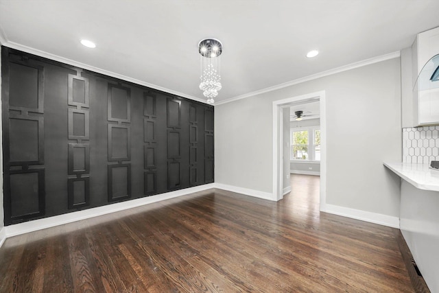9012 S Harper Ave, Chicago, IL 60619 - unfurnished dining area with baseboards, crown molding, a ceiling fan, dark wood-type flooring, and a chandelier