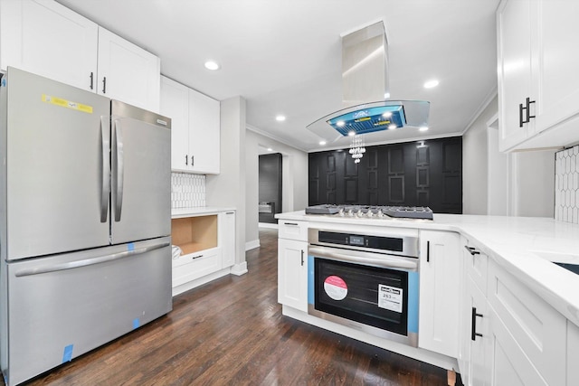9012 S Harper Ave, Chicago, IL 60619 - kitchen with stainless steel appliances, white cabinets, island exhaust hood, dark wood finished floors, and recessed lighting
