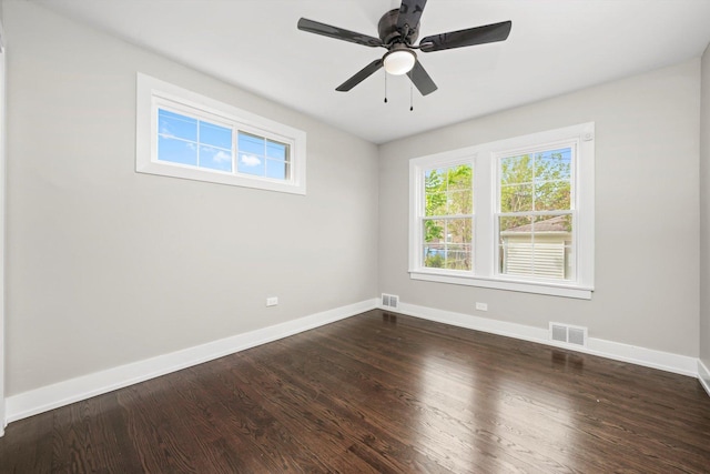 9012 S Harper Ave, Chicago, IL 60619 - spare room featuring baseboards, dark wood finished floors, and a ceiling fan